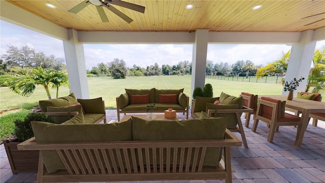 view of patio featuring ceiling fan and an outdoor living space