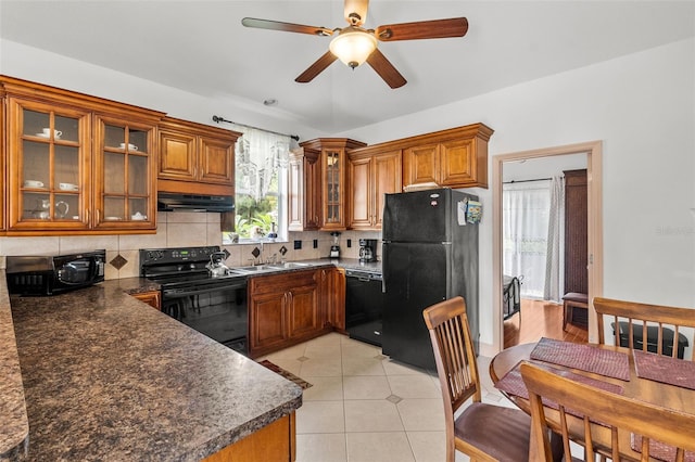 kitchen with ceiling fan, light hardwood / wood-style floors, black appliances, decorative backsplash, and sink