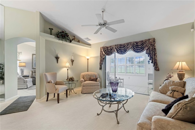 living room with light colored carpet, vaulted ceiling, and ceiling fan