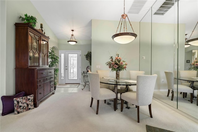 dining space with light carpet