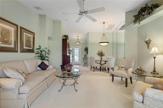 living room featuring carpet and ceiling fan