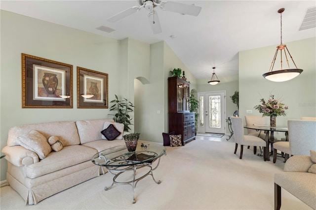 carpeted living room featuring ceiling fan