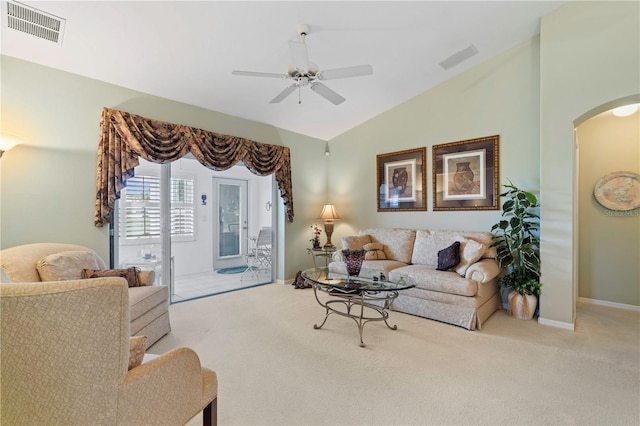 living room featuring ceiling fan, light colored carpet, and lofted ceiling