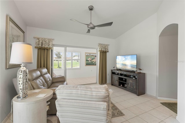 living room featuring light tile patterned floors, vaulted ceiling, and ceiling fan