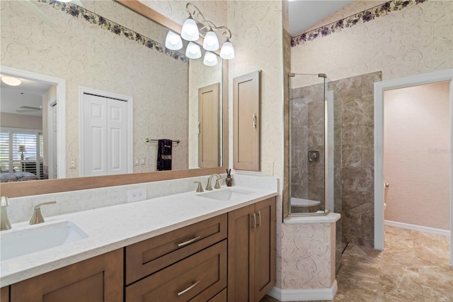 bathroom featuring vanity and tiled shower