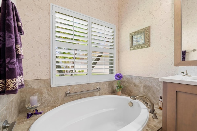 bathroom with vanity and a tub to relax in