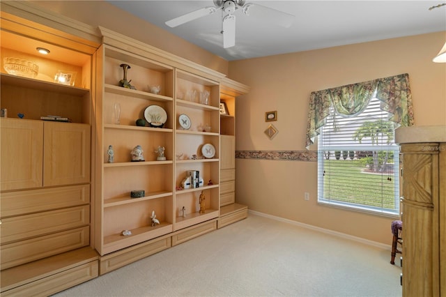 miscellaneous room featuring ceiling fan and light carpet