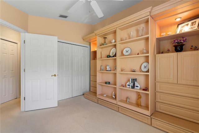 carpeted bedroom with a closet and ceiling fan