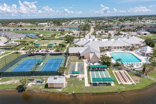 birds eye view of property with a water view