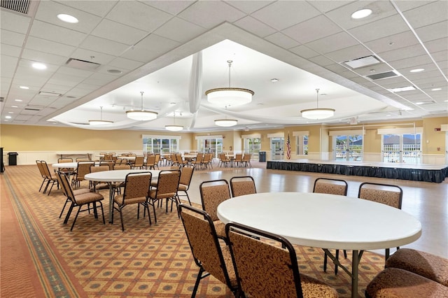 dining room with a drop ceiling