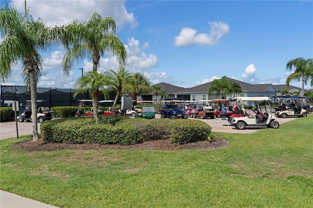 view of home's community with a yard