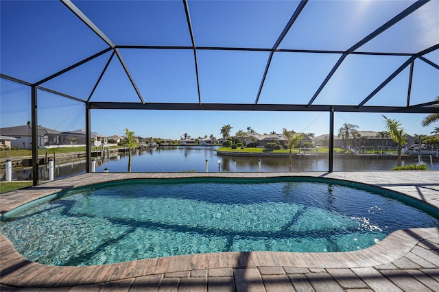 view of swimming pool featuring a lanai and a water view