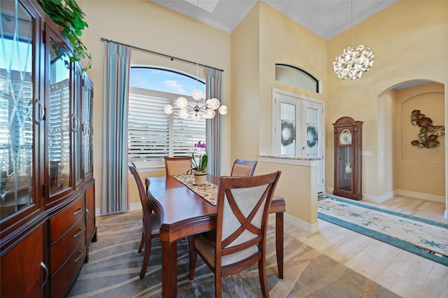 dining area featuring an inviting chandelier and crown molding