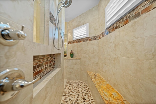 bathroom featuring tiled shower