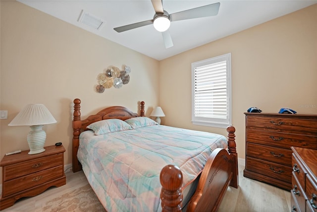 bedroom with ceiling fan and light hardwood / wood-style flooring