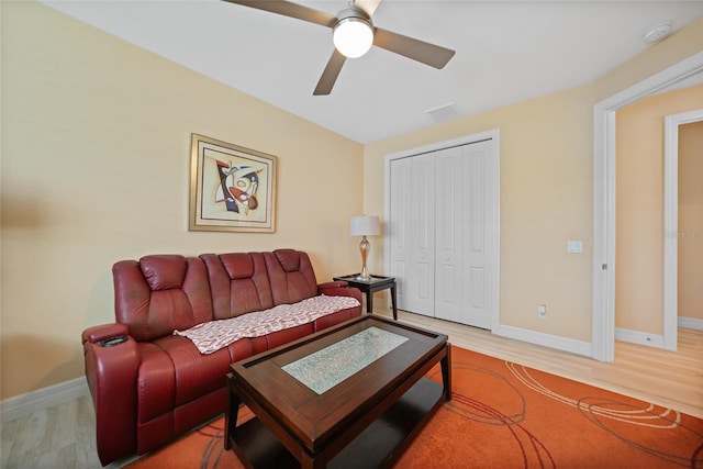 living room featuring ceiling fan and wood-type flooring