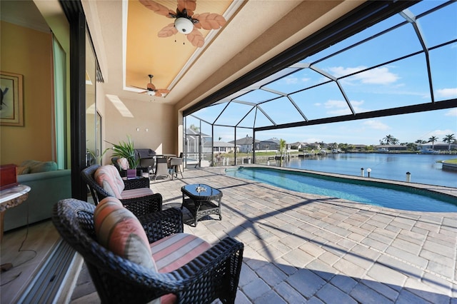 view of swimming pool with a patio, a water view, and glass enclosure