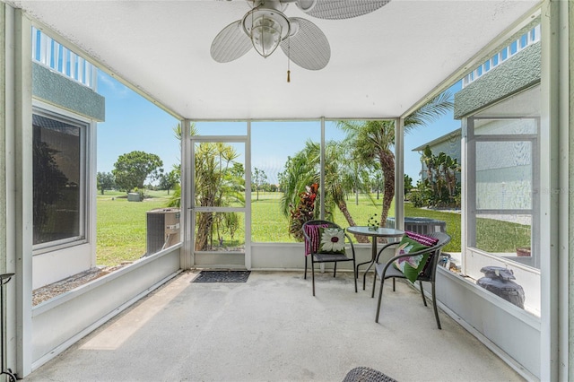 sunroom / solarium with ceiling fan and a wealth of natural light