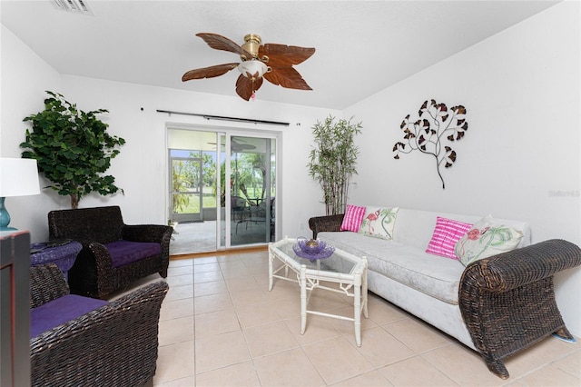 tiled living room with ceiling fan