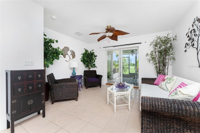 tiled living room with ceiling fan