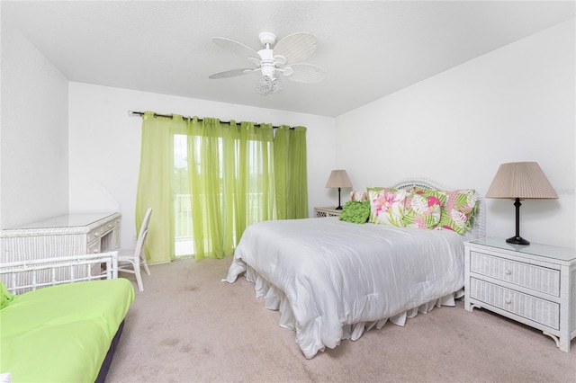 bedroom featuring light carpet and ceiling fan