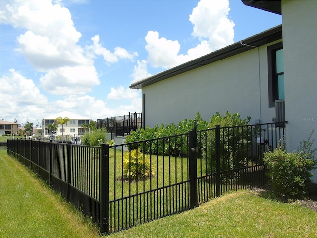 view of yard featuring a residential view and fence