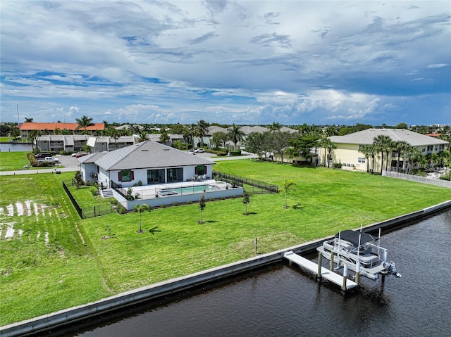 exterior space featuring a residential view and a water view