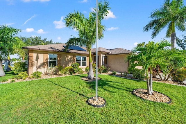 single story home with a front lawn