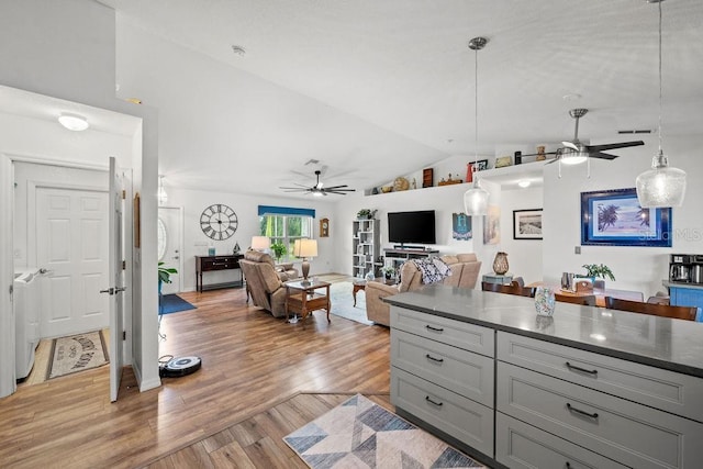 kitchen featuring lofted ceiling, gray cabinets, light hardwood / wood-style floors, and ceiling fan