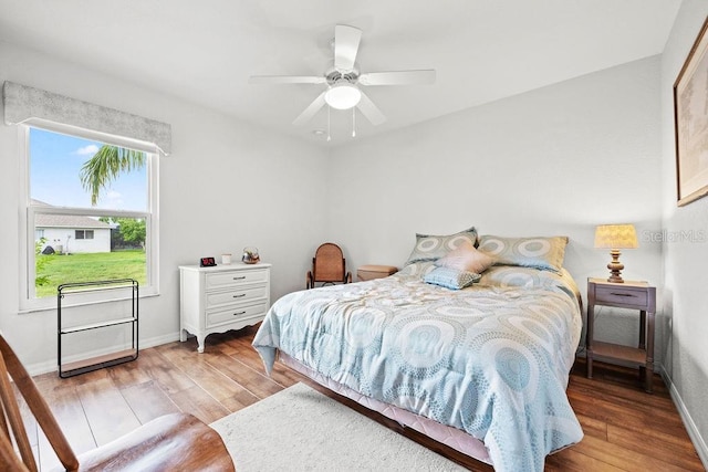 bedroom with ceiling fan and light hardwood / wood-style floors