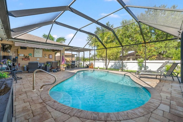 view of pool featuring a lanai and a patio area