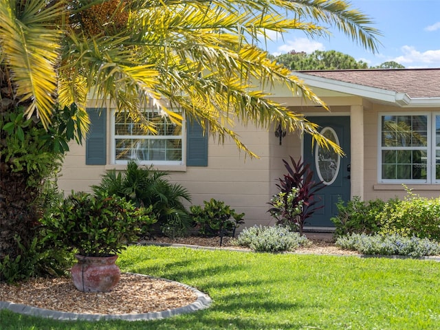 entrance to property with a yard