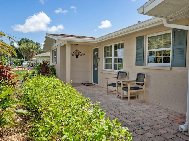 property entrance with a patio