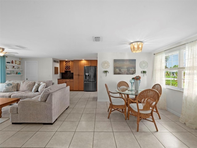 dining room featuring light tile patterned flooring and ceiling fan