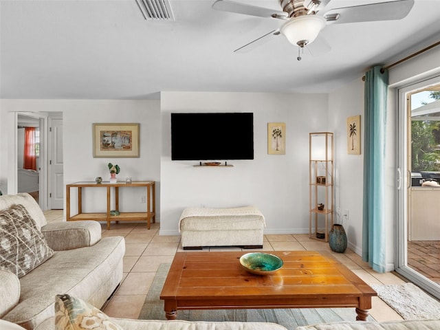 living room featuring ceiling fan and light tile patterned floors