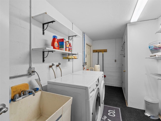 laundry room with washing machine and dryer and sink