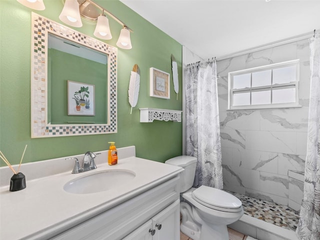 bathroom with a shower with curtain, vanity, and toilet