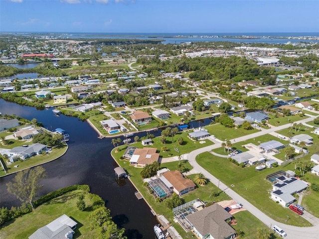 birds eye view of property featuring a water view