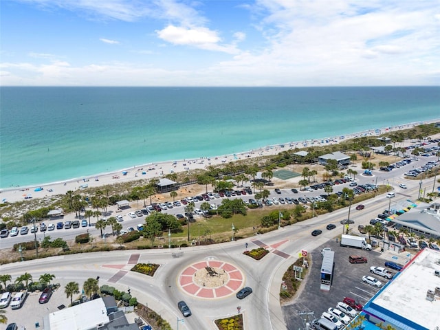 drone / aerial view with a water view and a view of the beach