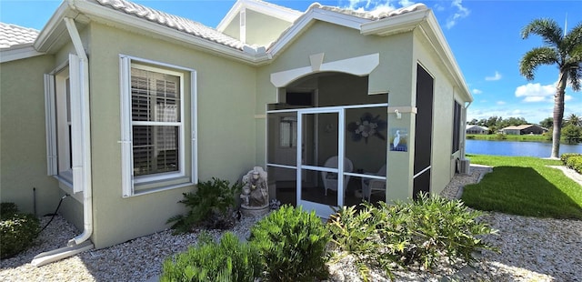 rear view of house with a water view