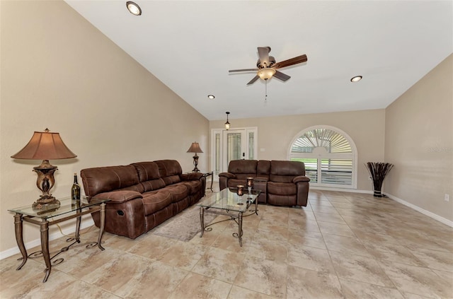 tiled living room with lofted ceiling and ceiling fan