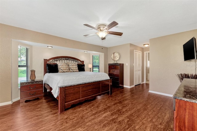 bedroom featuring dark hardwood / wood-style flooring and ceiling fan