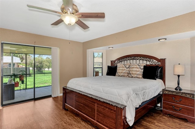 bedroom with access to exterior, hardwood / wood-style floors, and ceiling fan