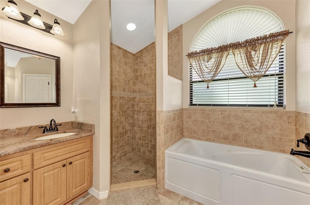 bathroom with vanity, tile patterned flooring, and separate shower and tub