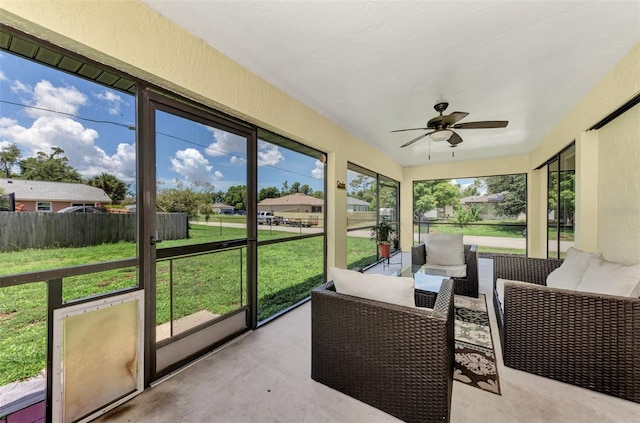 sunroom with plenty of natural light and ceiling fan