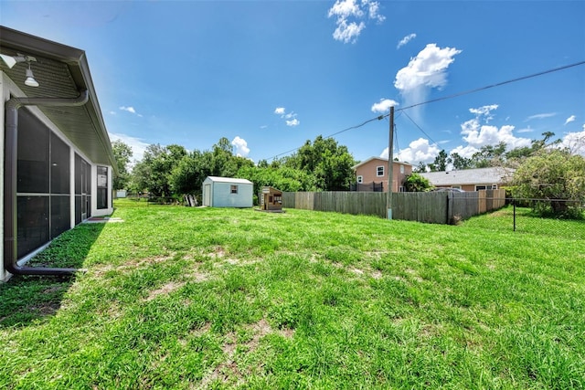 view of yard featuring a storage unit