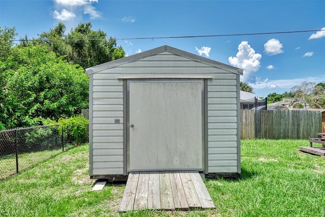 view of outdoor structure featuring a yard