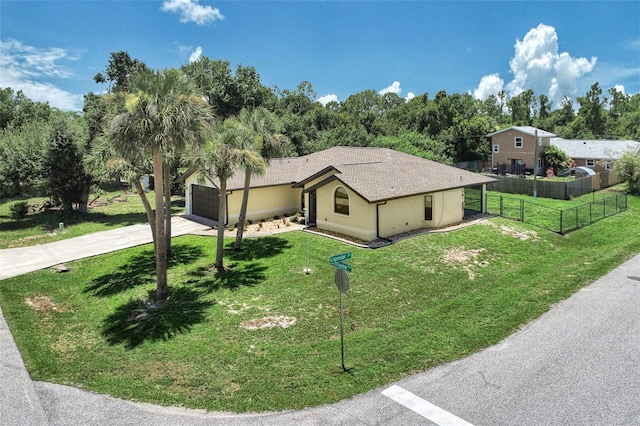 view of front of home featuring a garage and a front yard