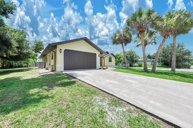 ranch-style home with a garage and a front yard