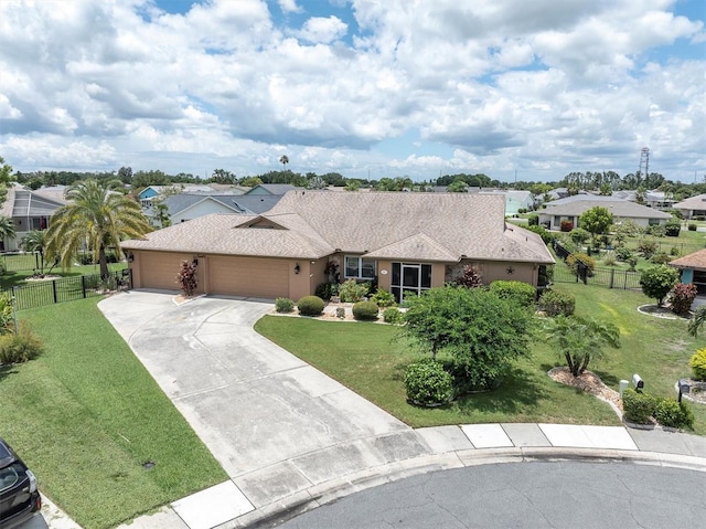 ranch-style home featuring a garage and a front lawn